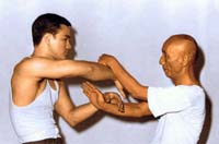 Grand Master Yip Man with Bruce Lee doing Chi Sao
